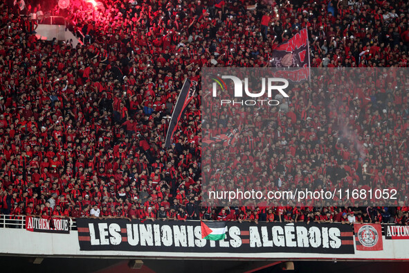 USM Alger fans cheer for their team during the football match between USM Alger and CR Belouizdad on the 5th day of the Algerian Ligue 1 cha...