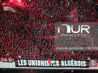 USM Alger fans cheer for their team during the football match between USM Alger and CR Belouizdad on the 5th day of the Algerian Ligue 1 cha...