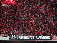 USM Alger fans cheer for their team during the football match between USM Alger and CR Belouizdad on the 5th day of the Algerian Ligue 1 cha...