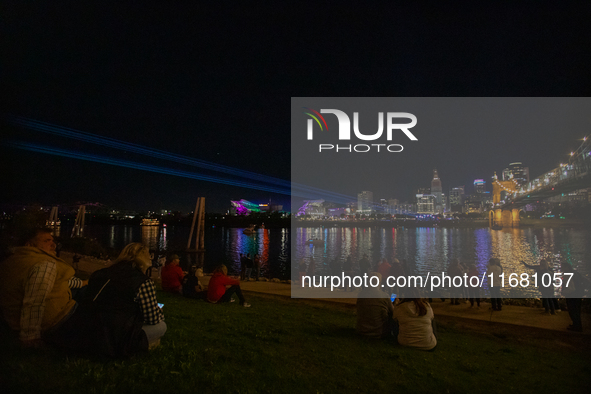 Spectators are seen during a light exhibit at the 2024 Blink Art and Light Festival in Cincinnati, Ohio, on October 18, 2024. 