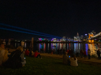 Spectators are seen during a light exhibit at the 2024 Blink Art and Light Festival in Cincinnati, Ohio, on October 18, 2024. (