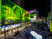 Spectators are seen during a light exhibit at the 2024 Blink Art and Light Festival in Cincinnati, Ohio, on October 18, 2024. (