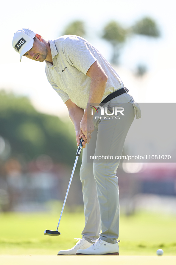 Victor Perez of France plays a shot on the 1st green on the third day of the Estrella Damm N.A. Andalucia Masters 2024 at Real Club de Golf...