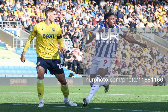 #16, Ben Nelson of Oxford, and #11, Grady Diangana of WBA are in action in the Oxford area during the Sky Bet Championship match between Oxf...