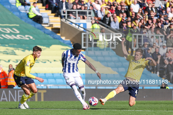 #11, Grady Diangana of WBA is in action as #4, Will Vaulks of Oxford moves to intercept during the Sky Bet Championship match between Oxford...