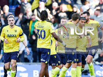 Dane Scarlett of Oxford (second from right) is congratulated for his goal, making it 1-1 during the Sky Bet Championship match between Oxfor...