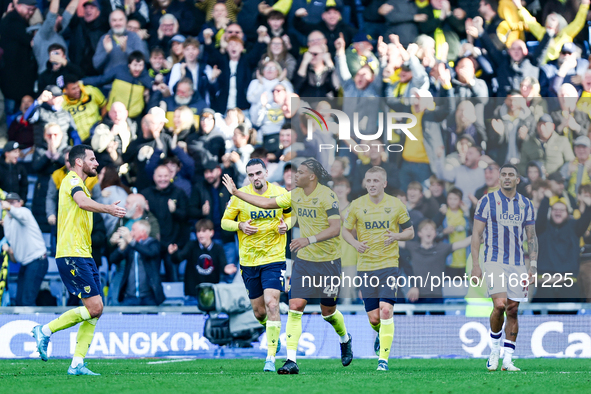 Dane Scarlett of Oxford is congratulated for his goal, making it 1-1 during the Sky Bet Championship match between Oxford United and West Br...