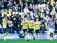 Dane Scarlett of Oxford is congratulated for his goal, making it 1-1 during the Sky Bet Championship match between Oxford United and West Br...