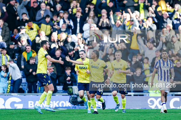 Dane Scarlett of Oxford is congratulated for his goal, making it 1-1 during the Sky Bet Championship match between Oxford United and West Br...