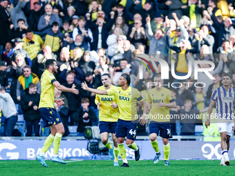 Dane Scarlett of Oxford is congratulated for his goal, making it 1-1 during the Sky Bet Championship match between Oxford United and West Br...