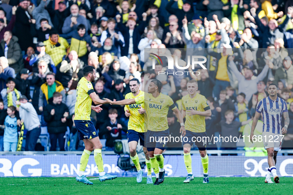 Dane Scarlett of Oxford is congratulated for his goal, making it 1-1 during the Sky Bet Championship match between Oxford United and West Br...