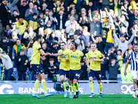 Dane Scarlett of Oxford is congratulated for his goal, making it 1-1 during the Sky Bet Championship match between Oxford United and West Br...