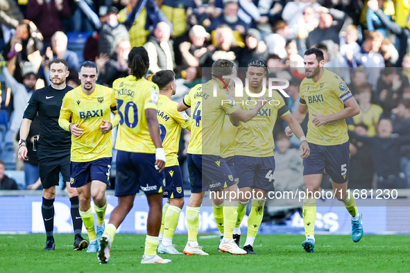 Dane Scarlett of Oxford is congratulated for his goal, making it 1-1 during the Sky Bet Championship match between Oxford United and West Br...