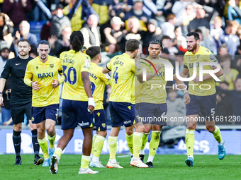 Dane Scarlett of Oxford is congratulated for his goal, making it 1-1 during the Sky Bet Championship match between Oxford United and West Br...