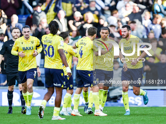 Dane Scarlett of Oxford is congratulated for his goal, making it 1-1 during the Sky Bet Championship match between Oxford United and West Br...