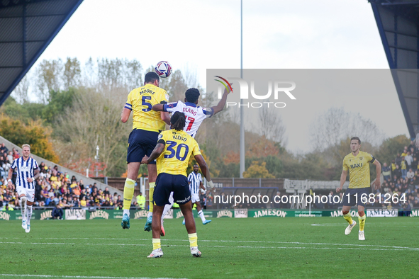 Elliott Moore of Oxford and Grady Diangana of WBA battle in the air during the Sky Bet Championship match between Oxford United and West Bro...