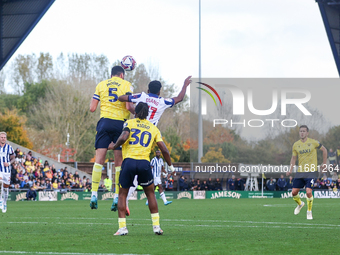 Elliott Moore of Oxford and Grady Diangana of WBA battle in the air during the Sky Bet Championship match between Oxford United and West Bro...