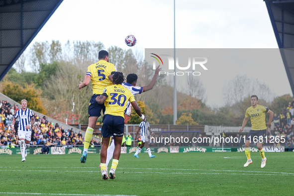 Elliott Moore of Oxford and Grady Diangana of WBA battle in the air during the Sky Bet Championship match between Oxford United and West Bro...