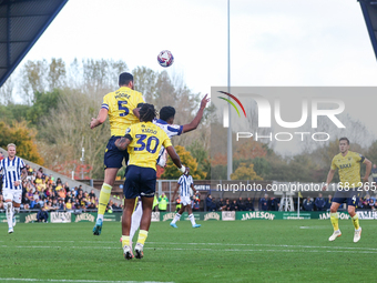 Elliott Moore of Oxford and Grady Diangana of WBA battle in the air during the Sky Bet Championship match between Oxford United and West Bro...