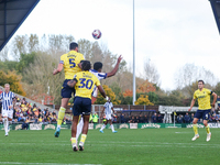 Elliott Moore of Oxford and Grady Diangana of WBA battle in the air during the Sky Bet Championship match between Oxford United and West Bro...