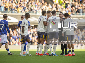 Referee Michael Oliver is surrounded by Everton players during the Premier League match between Ipswich Town and Everton at Portman Road in...