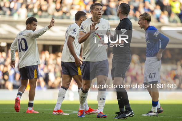 James Tarkowski of Everton interacts with the referee, Michael Oliver, during the Premier League match between Ipswich Town and Everton at P...