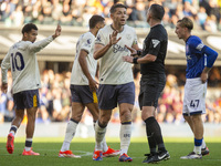 James Tarkowski of Everton interacts with the referee, Michael Oliver, during the Premier League match between Ipswich Town and Everton at P...