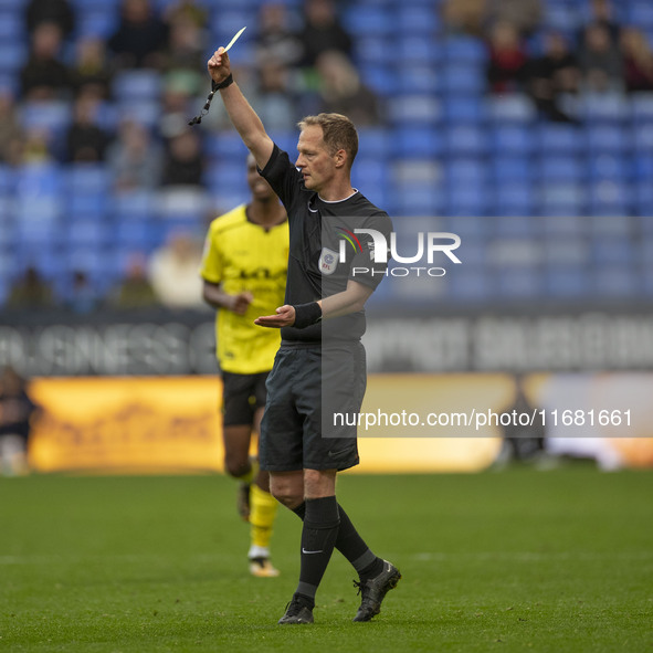 Referee Martin Coy shows a yellow card to Ryan Sweeney #6 of Burton Albion F.C. during the Sky Bet League 1 match between Bolton Wanderers a...