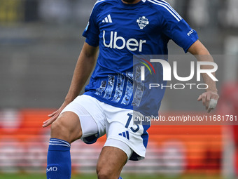 Alberto Dossena of Calcio Como participates in the Italian Serie A football match between Calcio Como and Parma Calcio 1913 in Como, Italy,...