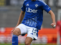 Alberto Dossena of Calcio Como participates in the Italian Serie A football match between Calcio Como and Parma Calcio 1913 in Como, Italy,...