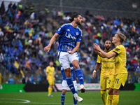 Alberto Dossena of Calcio Como participates in the Italian Serie A football match between Calcio Como and Parma Calcio 1913 in Como, Italy,...