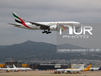 A Boeing 777-21H(LR) from Emirates lands at Barcelona airport in Barcelona, Spain, on October 15, 2024. (