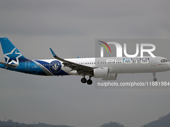 An Airbus A321-271NX from Air Transat, featuring a CF Montreal sticker, lands at Barcelona airport in Barcelona, Spain, on October 15, 2024....