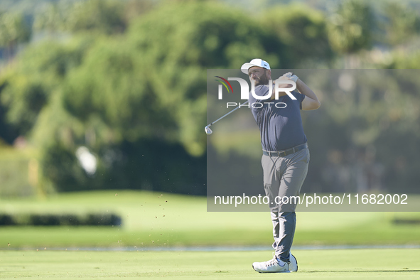 Jon Rahm of Spain plays his second shot on the 14th hole on the third day of the Estrella Damm N.A. Andalucia Masters 2024 at Real Club de G...