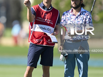 Angel Hidalgo of Spain talks with his caddie on the 14th hole on the third day of the Estrella Damm N.A. Andalucia Masters 2024 at Real Club...