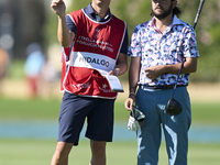 Angel Hidalgo of Spain talks with his caddie on the 14th hole on the third day of the Estrella Damm N.A. Andalucia Masters 2024 at Real Club...