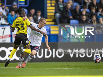 Kyle Dempsey #22 of Bolton Wanderers F.C. is tackled by Kgagelo Chauke #33 of Burton Albion F.C. during the Sky Bet League 1 match between B...