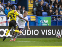 Kyle Dempsey #22 of Bolton Wanderers F.C. is tackled by Kgagelo Chauke #33 of Burton Albion F.C. during the Sky Bet League 1 match between B...