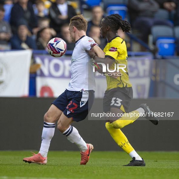 Kyle Dempsey #22 of Bolton Wanderers F.C. is tackled by Kgagelo Chauke #33 of Burton Albion F.C. during the Sky Bet League 1 match between B...