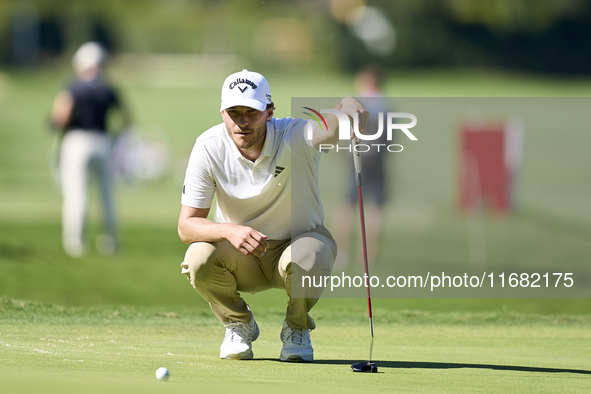 Rasmus Hojgaard of Denmark studies his shot on the 14th green on the third day of the Estrella Damm N.A. Andalucia Masters 2024 at Real Club...