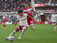 Bristol City's Yu Hirakawa shields the ball from Middlesbrough's Neto Borges during the Sky Bet Championship match between Middlesbrough and...