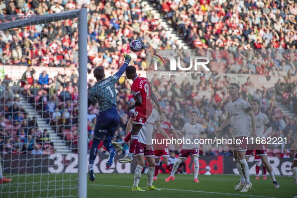 Bristol City goalkeeper Max O'Leary punches clear under pressure from Middlesbrough's Emmanuel Latte Lath during the Sky Bet Championship ma...