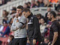 Middlesbrough Manager Michael Carrick discusses options with his assistant Jonathan Woodgate during the Sky Bet Championship match between M...