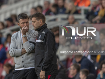 Middlesbrough Manager Michael Carrick discusses options with his assistant Jonathan Woodgate during the Sky Bet Championship match between M...