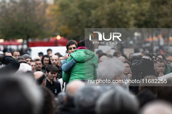 Emotion exists between Paul Varry's mother and an activist during a gathering at the Place de La Republique in Paris, France, on October 19,...