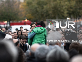 Emotion exists between Paul Varry's mother and an activist during a gathering at the Place de La Republique in Paris, France, on October 19,...