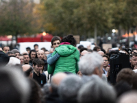 Emotion exists between Paul Varry's mother and an activist during a gathering at the Place de La Republique in Paris, France, on October 19,...