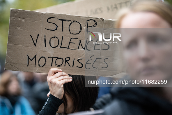 A demonstrator holds a sign reading ''Stop motorised violence'' during a gathering at the Place de La Republique in Paris, France, on Octobe...