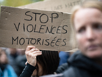 A demonstrator holds a sign reading ''Stop motorised violence'' during a gathering at the Place de La Republique in Paris, France, on Octobe...