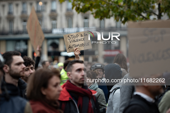 A demonstrator holds a sign reading ''Stop car violence'' during a gathering at the Place de La Republique in Paris, France, on October 19,...